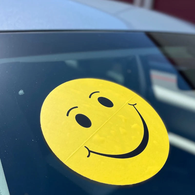 Smiley face decals on a car windshield