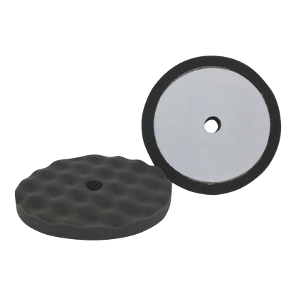 Two black waffle foam polishing pads with hook-and-loop backing