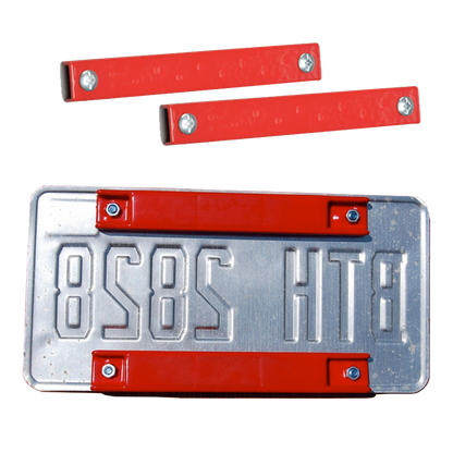 Red PVC-coated 8" bar magnet license plate holders, two loose with screws and two mounted on a license plate