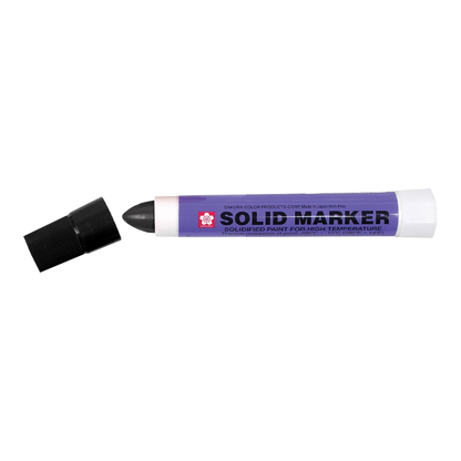 Black Sakura Solid Marker solidified paint marker with cap off, on white